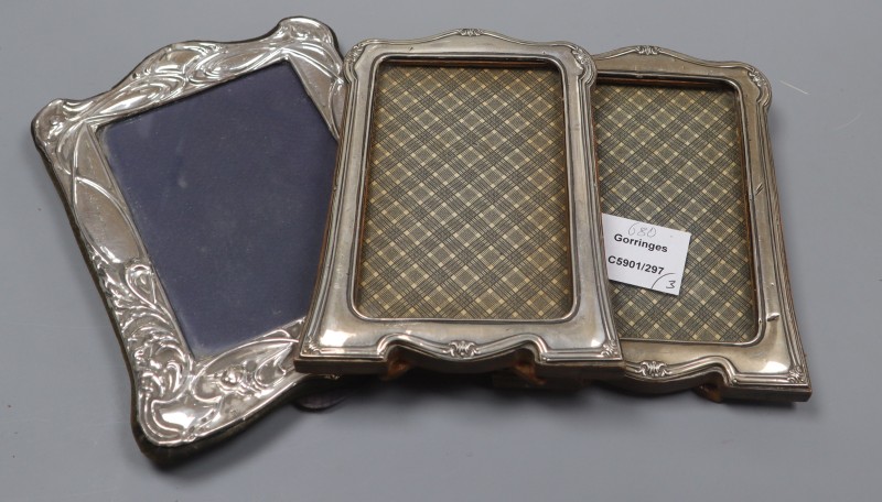 A pair of George V silver mounted photograph frames, Birmingham, 1923, 17.7cm and a modern silver frame.